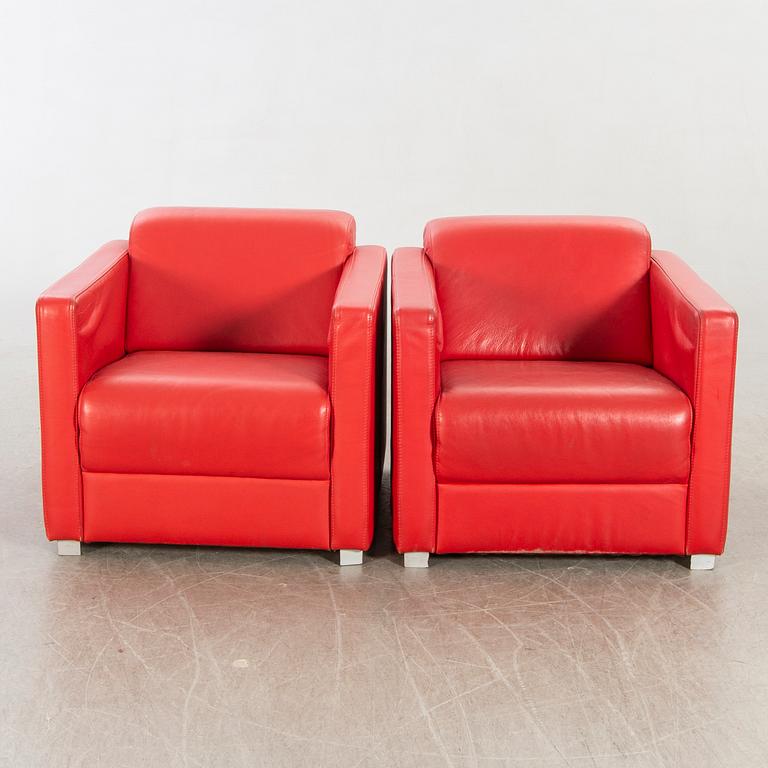 A pair of Italian 1990's leather armchairs.