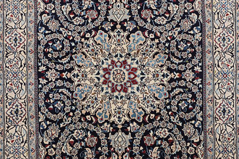 A carpet, Nain, part silk, 9 Laa, ca 295 x 197 cm.