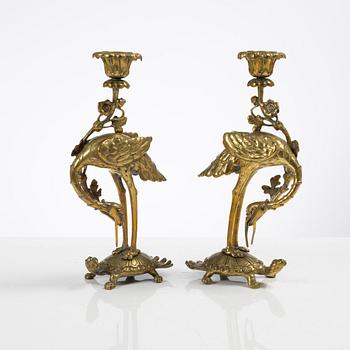 A pair of brass candle sticks, late Qing dynasty / early 20th century.