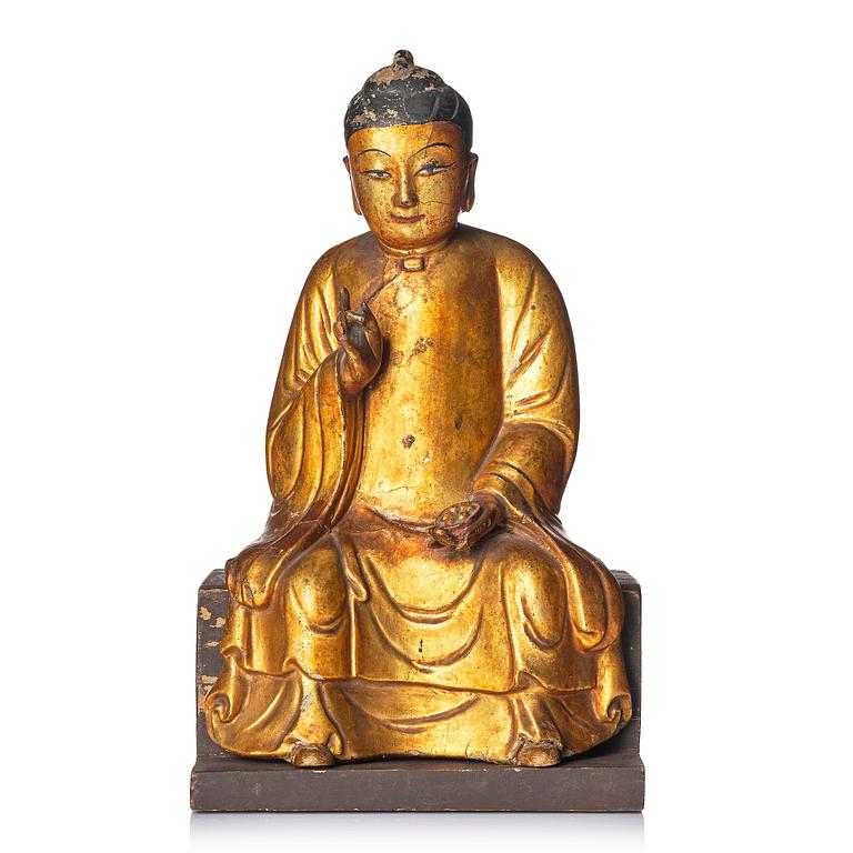 A gilt and polychrome lacquer figure of a divinity, 16th/17th century.