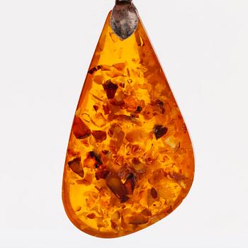 Amber set in silver, pendant, ring and earrings.