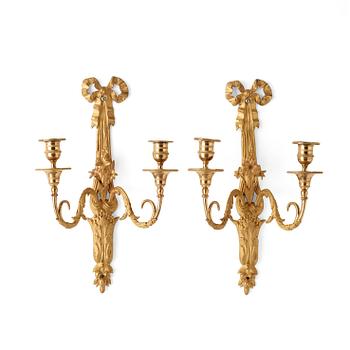 A pair of Louis XVI late 18th century gilt bronze two-light wall-lights.