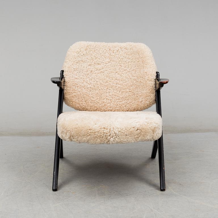 A 1950's 'Triva' easy chair by Bengt Ruda, from Nordiska Kompaniet.