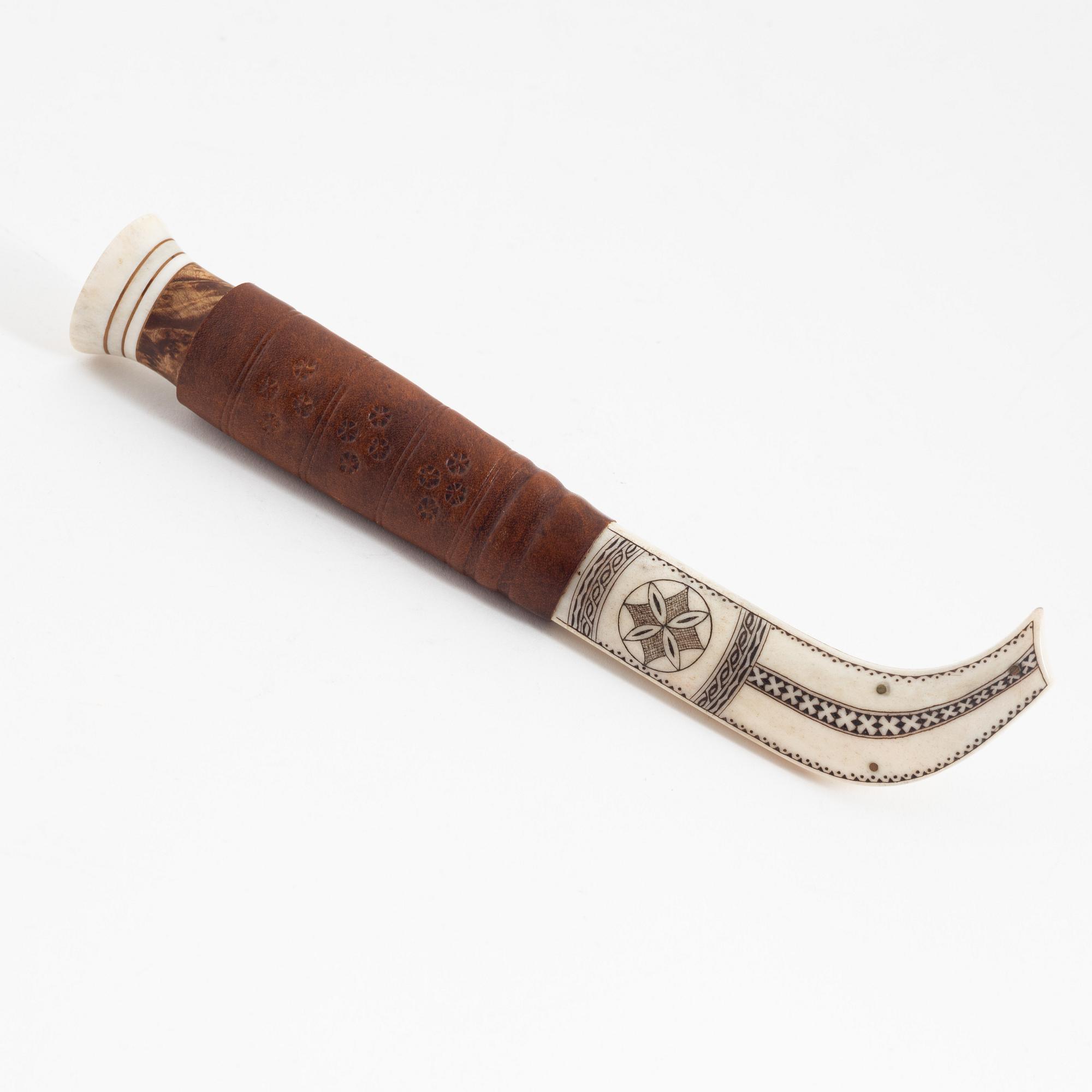 Jon Tomas Utsi, a reindeer horn knife, signed Jon T Utsi.