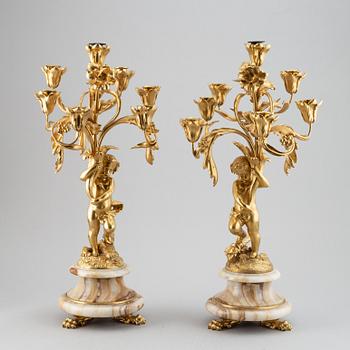 A pair of mid 19th century ormolu and onyx candelabra.