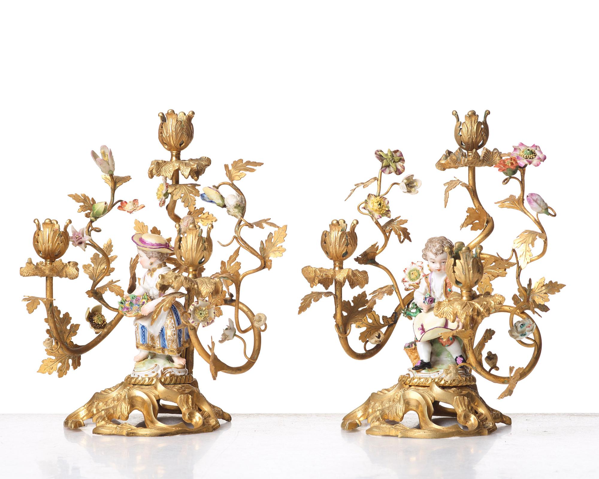 A pair of Meissen Rococo-style three-light candelabra, second half of the 1800's.