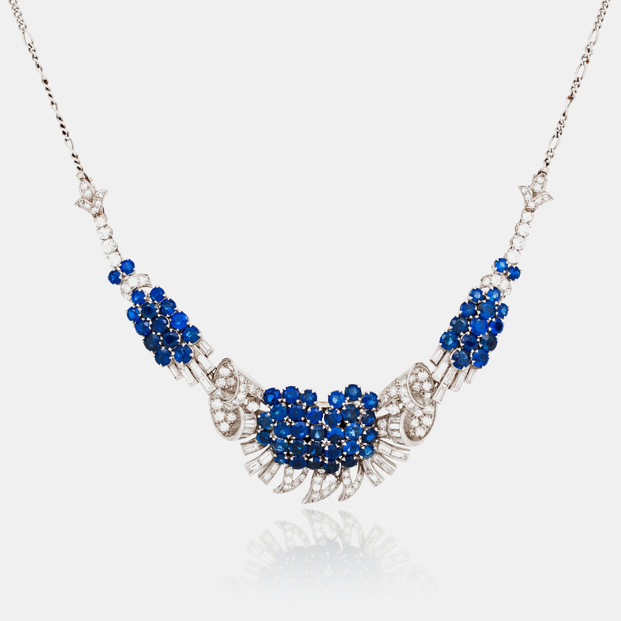 A diamond and sapphire set, probably Garrard & co. The set can be worn as a necklace, earrings, double clip or brooch.