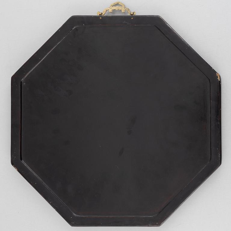 Four black-lacquered wall decorations, China, around 1900.