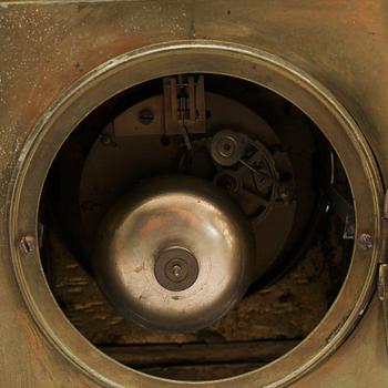 A table clock and two candelabras, around the year 1900.