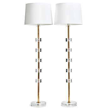 331. Carl Fagerlund, a pair of glass and brass floor lights, Orrefors,  Sweden 1960-70's, model RD1990.