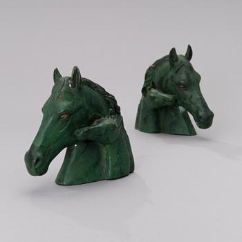 A pair of bronze bookends from the second half of the 20th century.