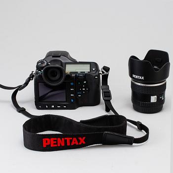 A black body medium format Pentax 645D camera with a SMC Pentax-D FA 645 55mm F2.8 AL [IF] SDM AW lens.