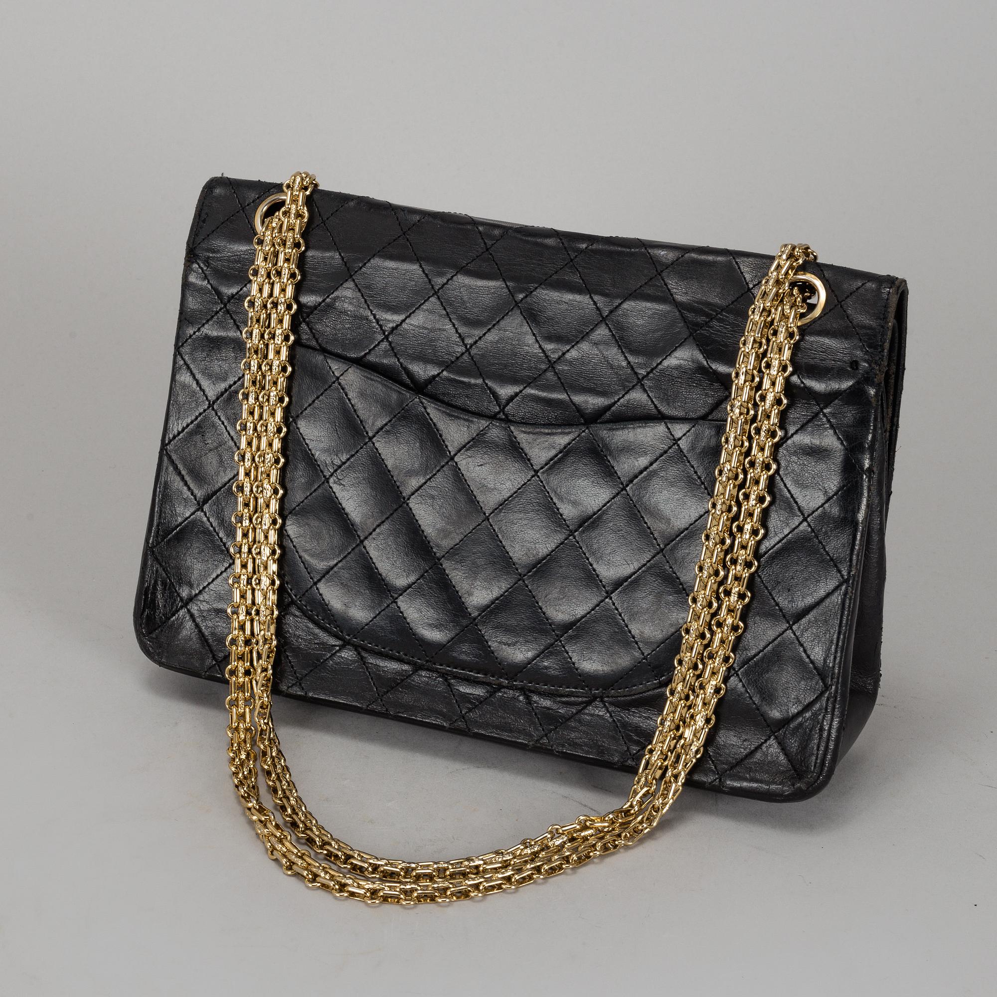 CHANEL, a quilted black leather 'Double Flap Bag'.