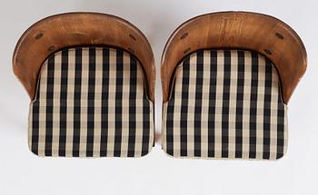 Axel Einar Hjorth, a pair of "Lovö" stained pine armchairs, Nordiska Kompaniet 1930s.