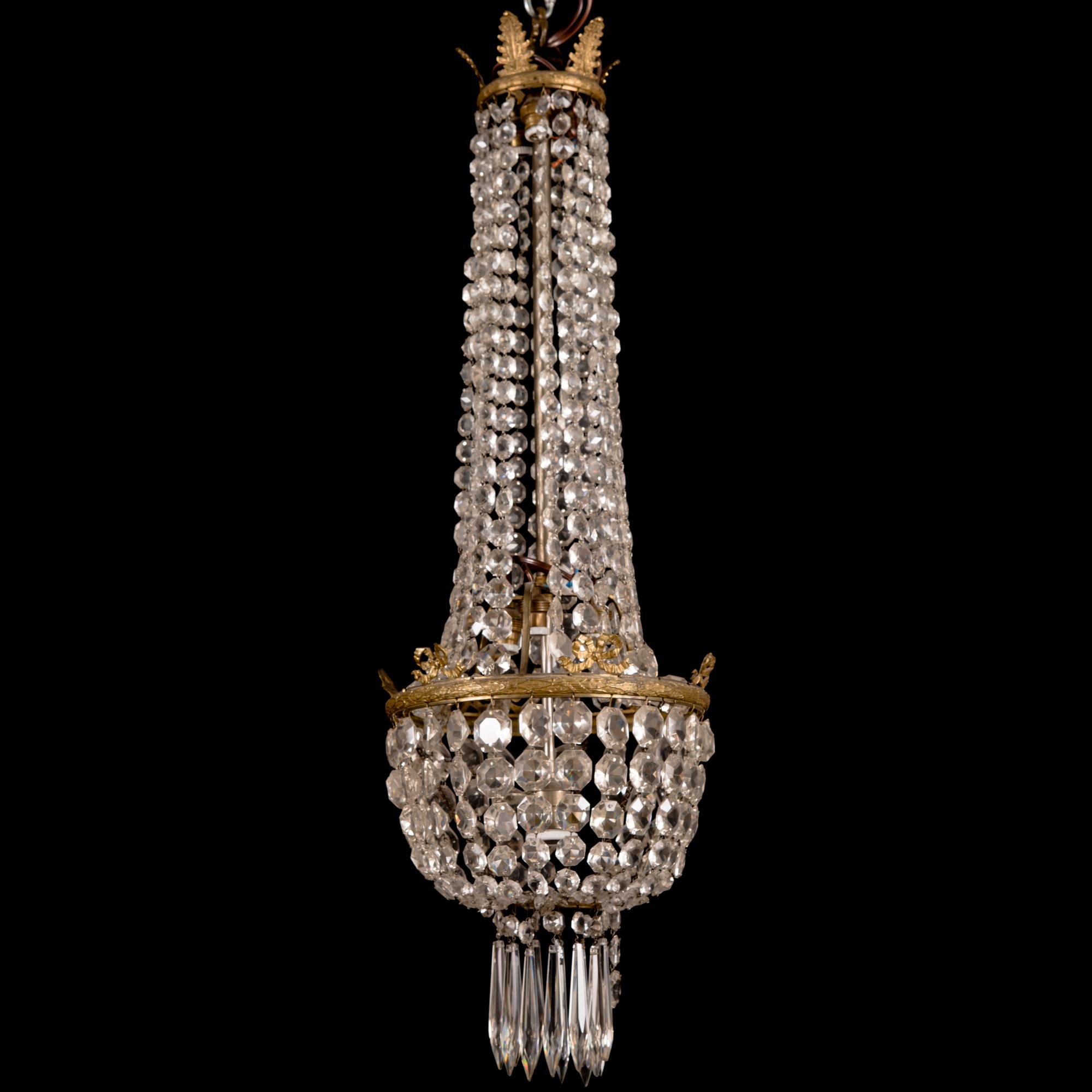 An early 20th century cut glass chandelier.