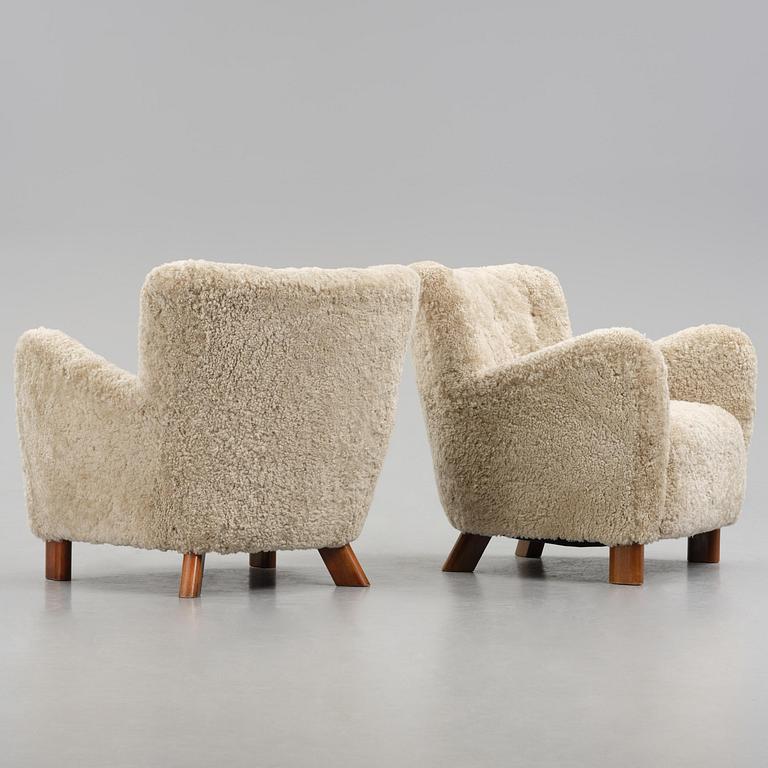 Fritz Hansen, a pair of easy chairs model "1669", Denmark, 1940s.
