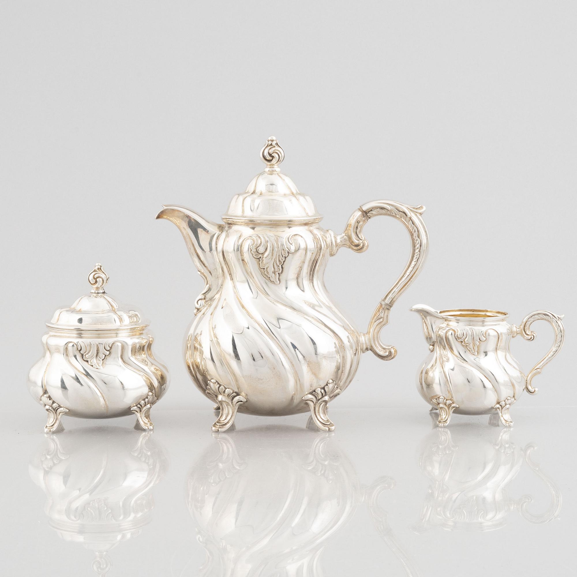 A German Rococo-Style Silver Coffee Pot, Creamer and Sugar Bowl, mark of MH Wilkens & Söhne, Bremen-Hemelingen.