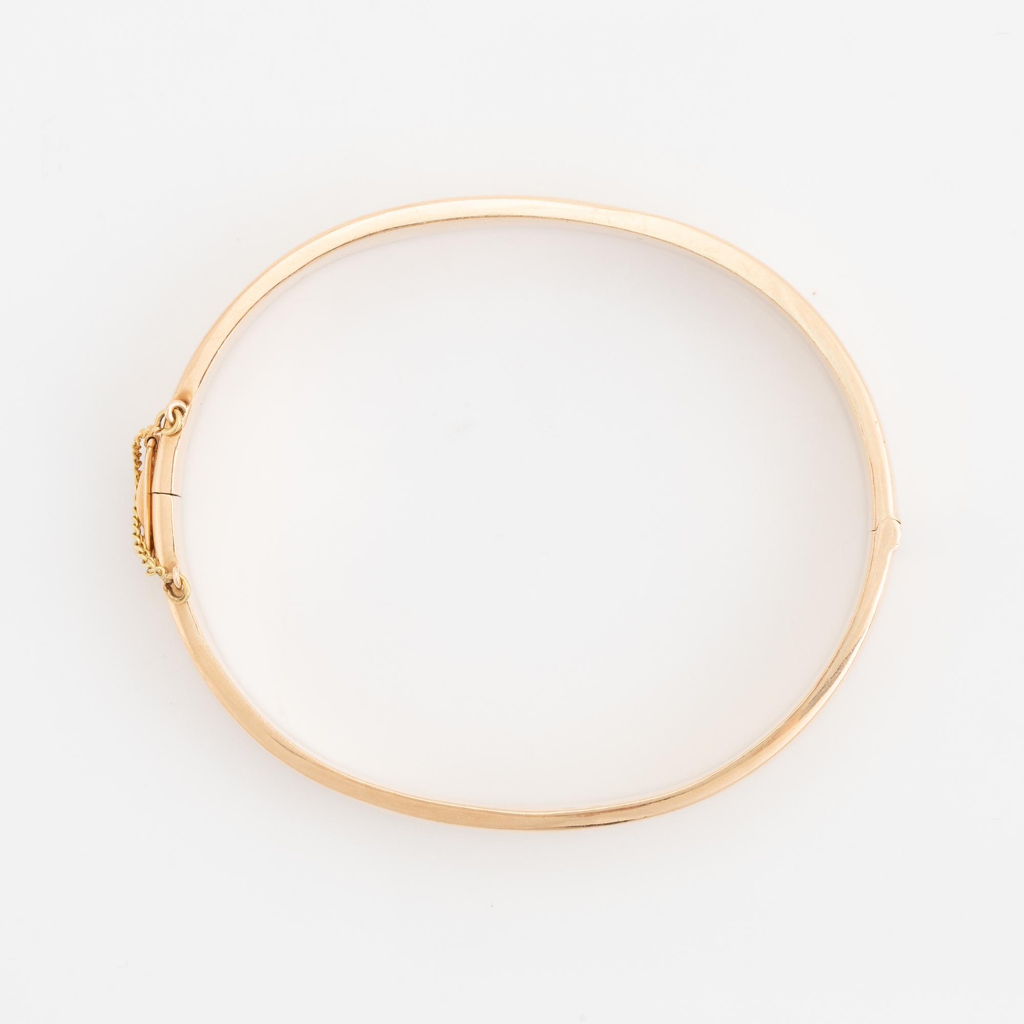 A 14K gold bracelet.