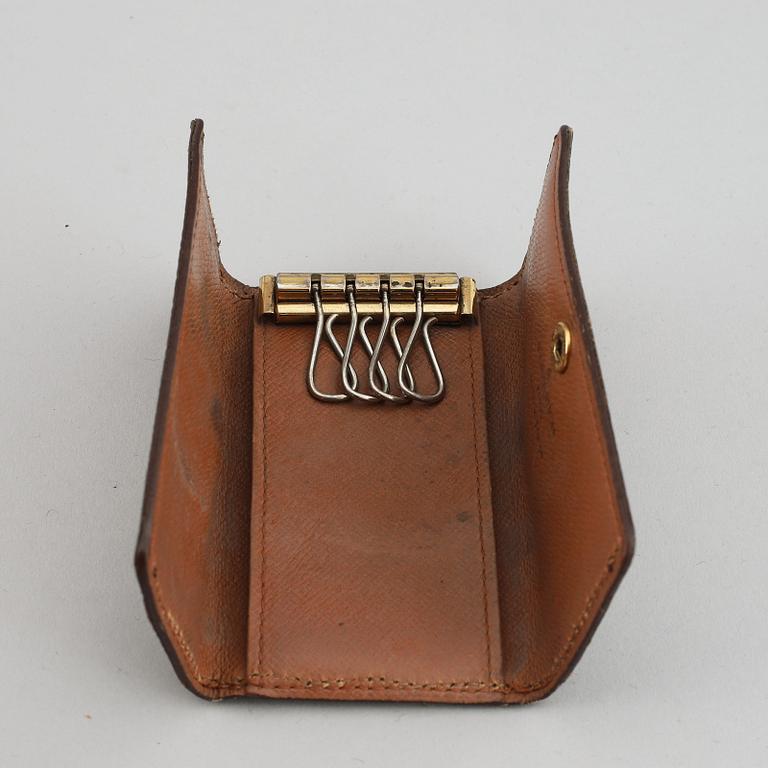 LOUIS VUITTON, a 'Trousse toilette 28' toilet bag and a key case.