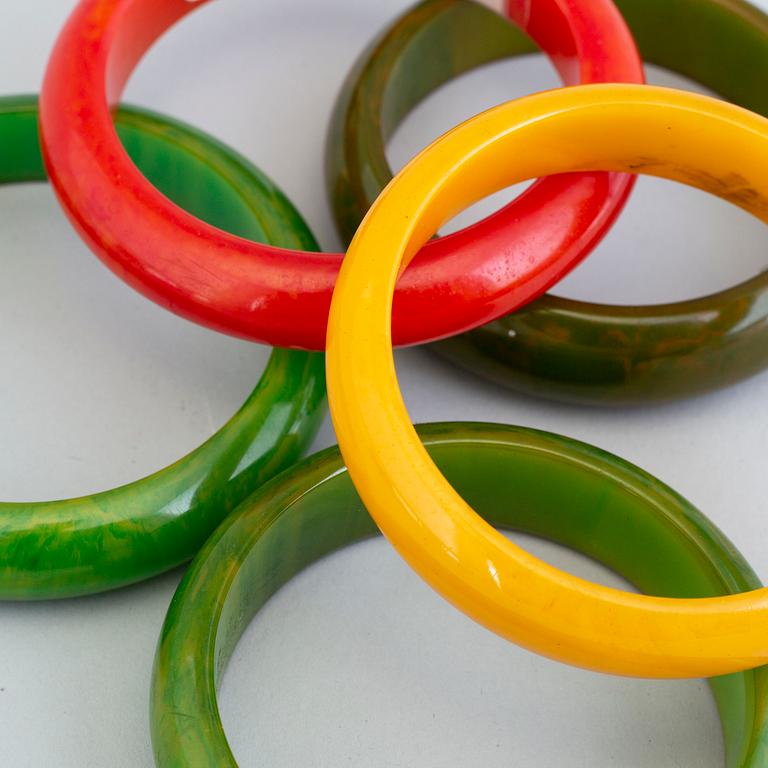 a set of eight plastic and bakelit bracelets, 20th century.