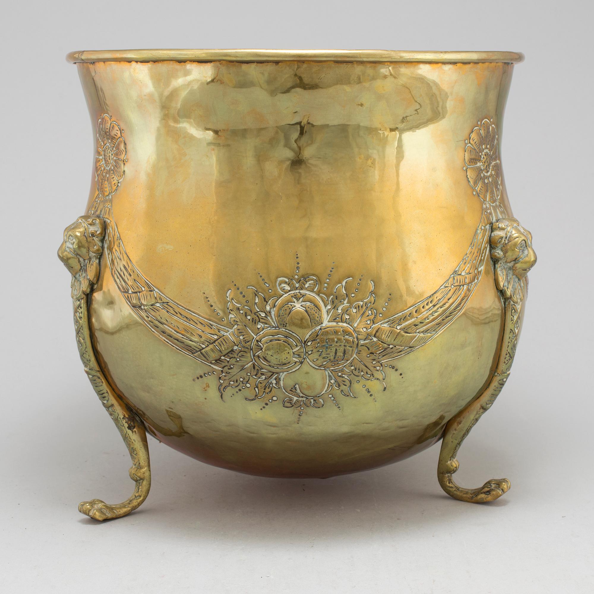 An 18th century brass flower pot.