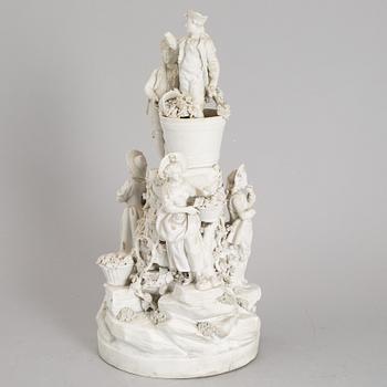 A biscuit porcelain figure group, circa 1900.