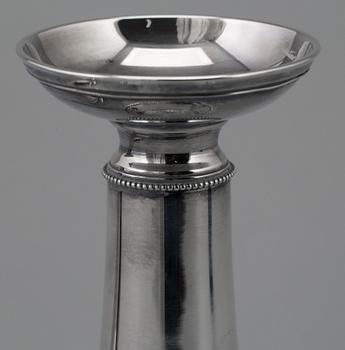 A pair of silver candlesticks by GAB, dated 1953.