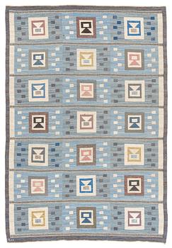 Edna Martin, a carpet, 'Flickorna i fönstret', flat weave, c 295 x 202 cm, signed SH.