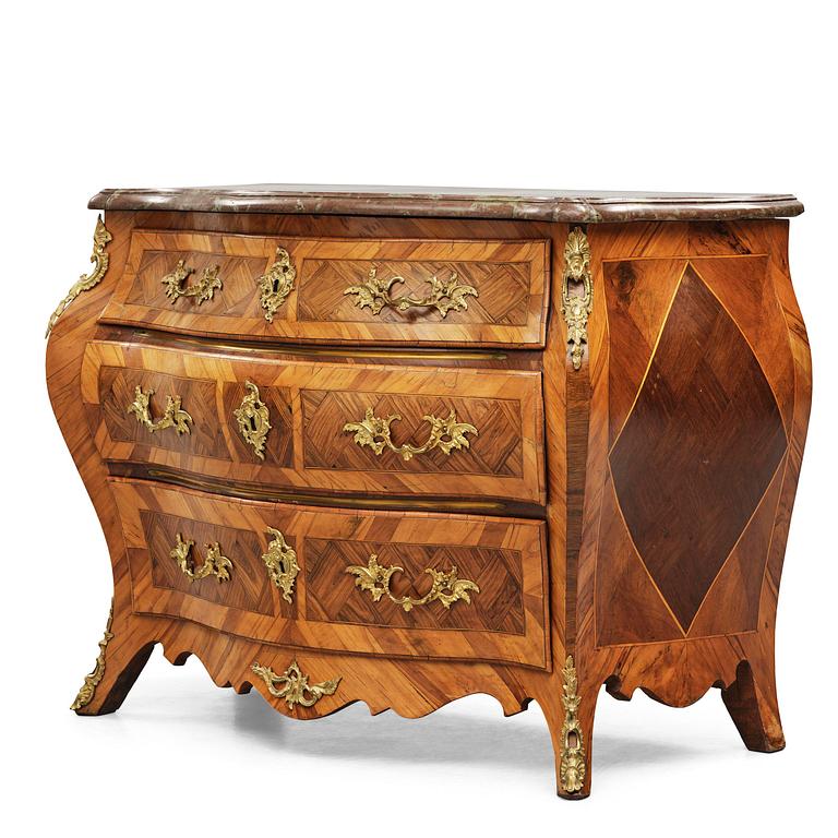 A rococo parquetry and gilt brass-mounted commode attrbuted to M. Engström (master in Stockholm 1758-97).