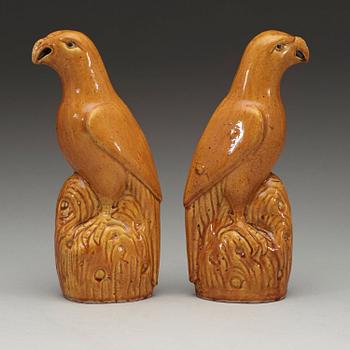 A pair of brown and yellow glazed figures of parrots, Qing dynasty, presumably 18th Century.