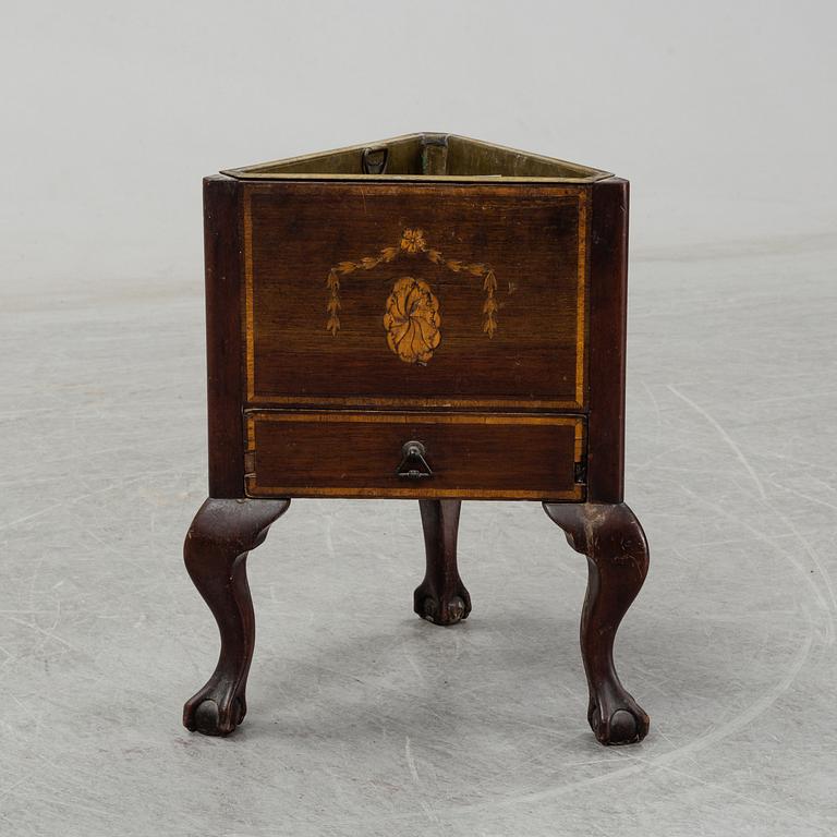 An English mahogany veneered wine cooler, circa 1900.