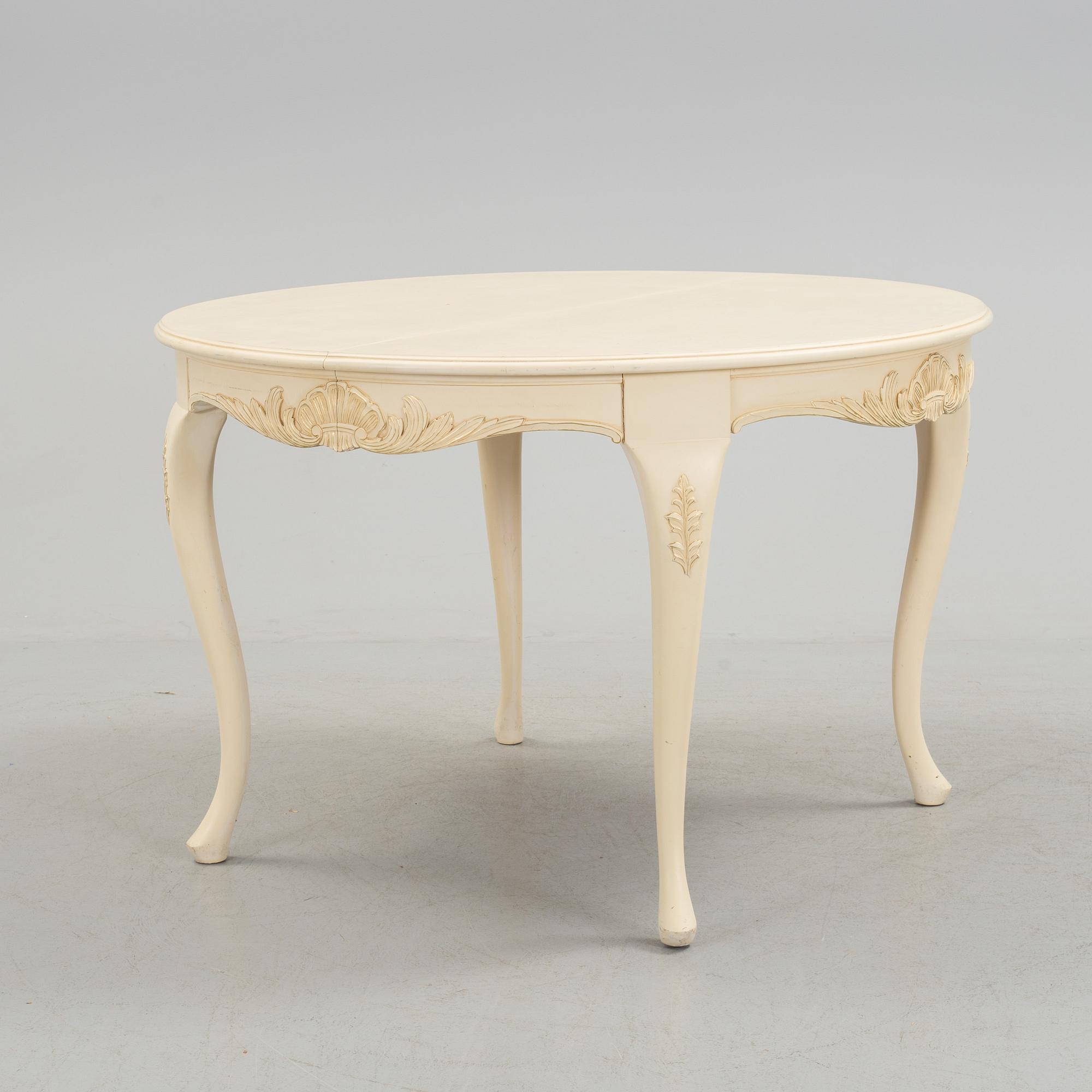 A mid 20th century rococo style dining table.