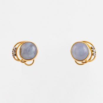 Gold with star sapphire and small diamond clip earrings, A. Tillander.