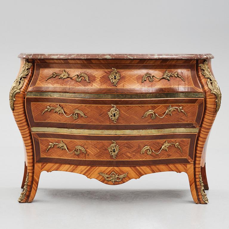 A Swedish Rococo commode, veneered with rosewood and amaranth.