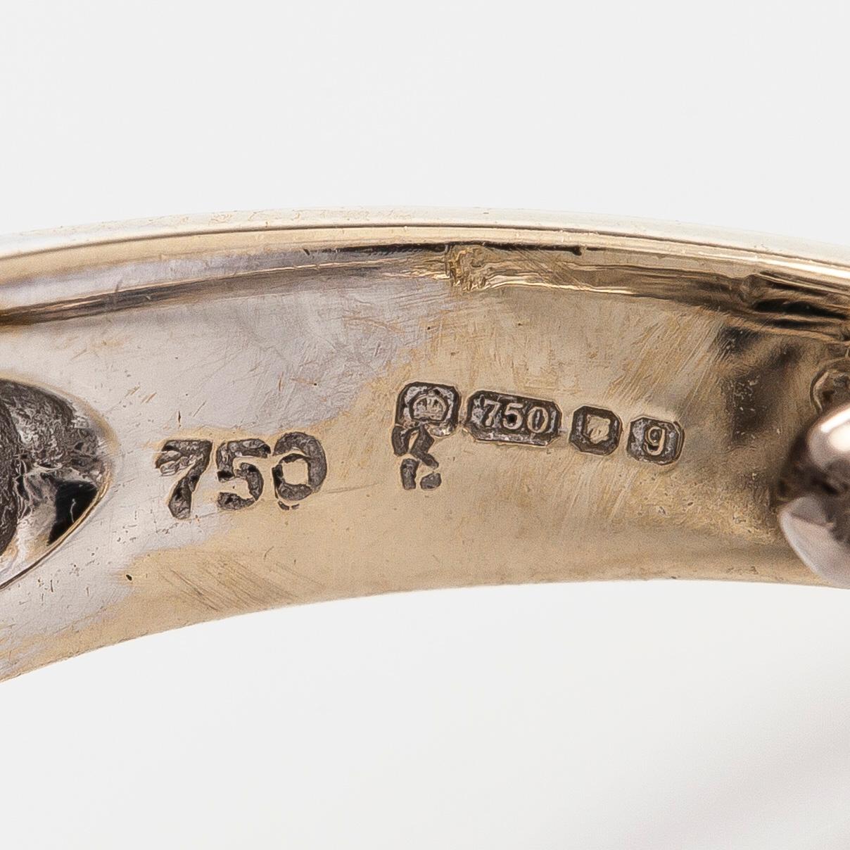 Sormus, musta ja valkoinen onyksi briljanttihiotut timantit.