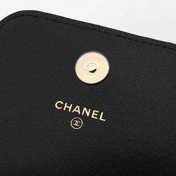 Chanel, a quilted black leather bag, 2021.