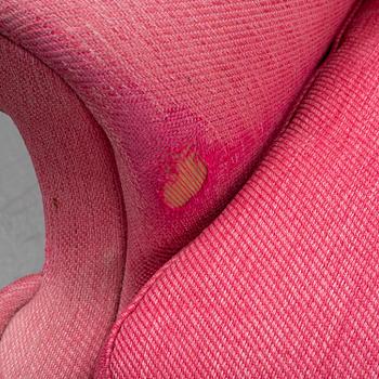 An 'Oxford' model no 3543 easy chair with stool by Ragnar Helsén for Firma Svenskt Tenn.