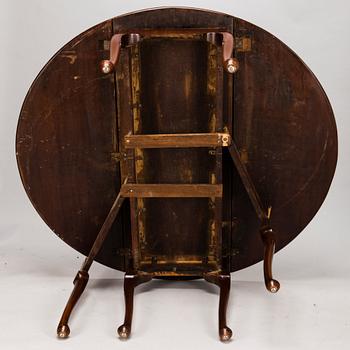 An 18th century English drop-leaf table.