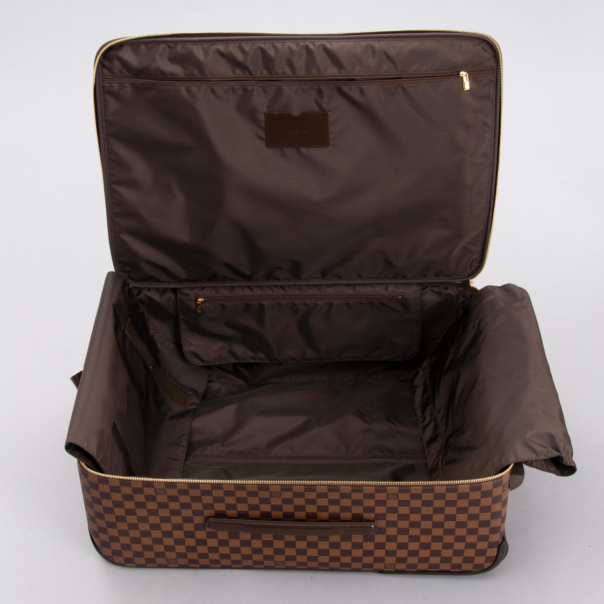 LOUIS VUITTON Damier Ebene Brown Pégase Suitcase with protective cover.