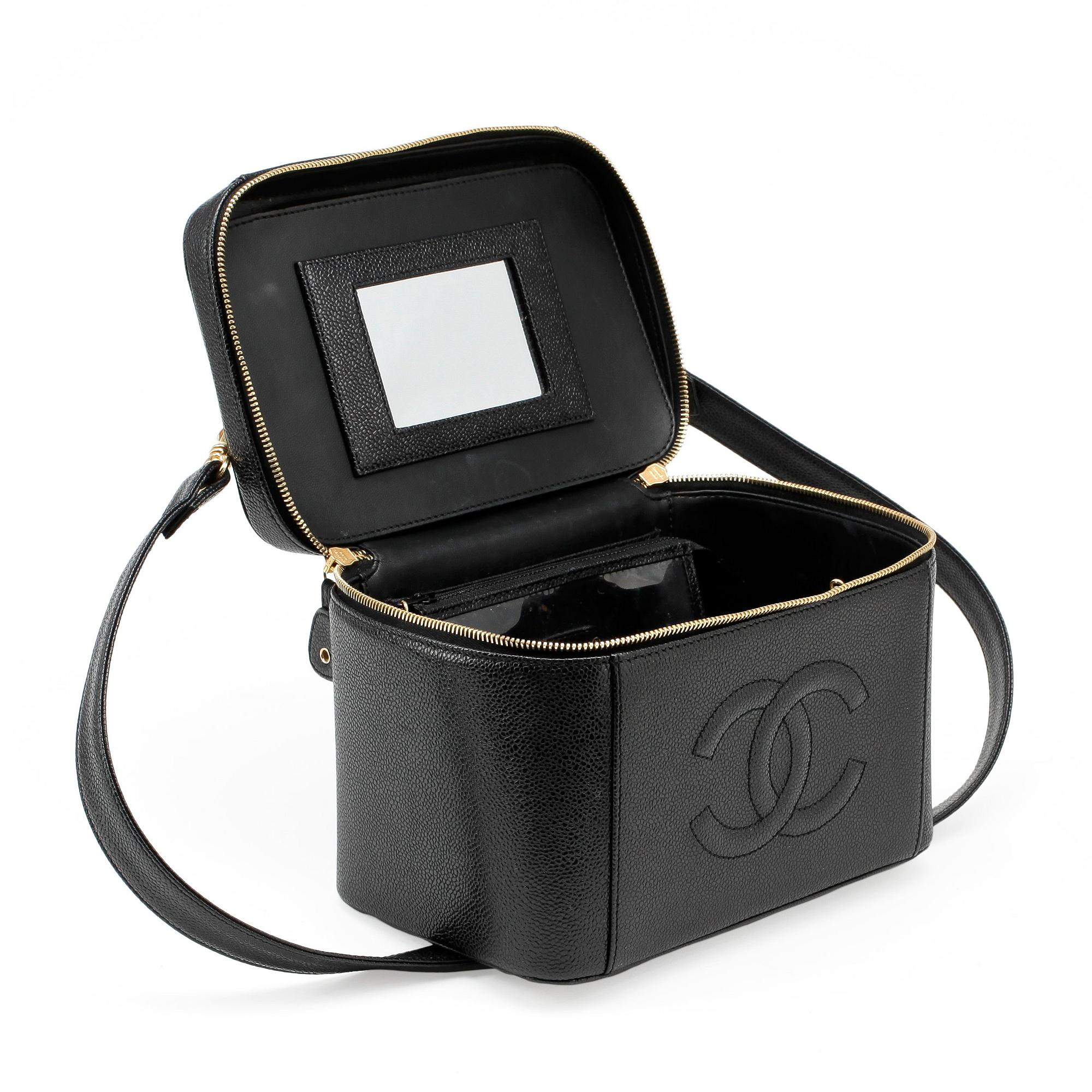 CHANEL, a black caviar leather beauty case.