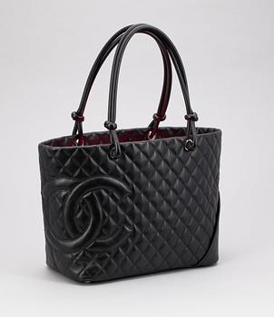 1234. A black quilt leather handbag by Chanel, model "Grand shopping" from 2004.