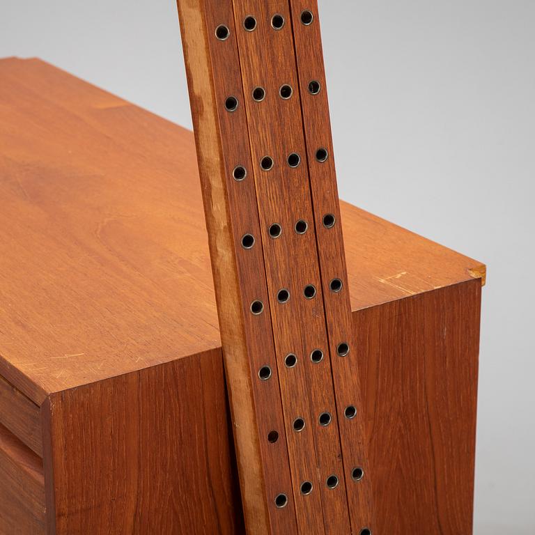 A 1960's teak shelving system by Poul Cadovius.