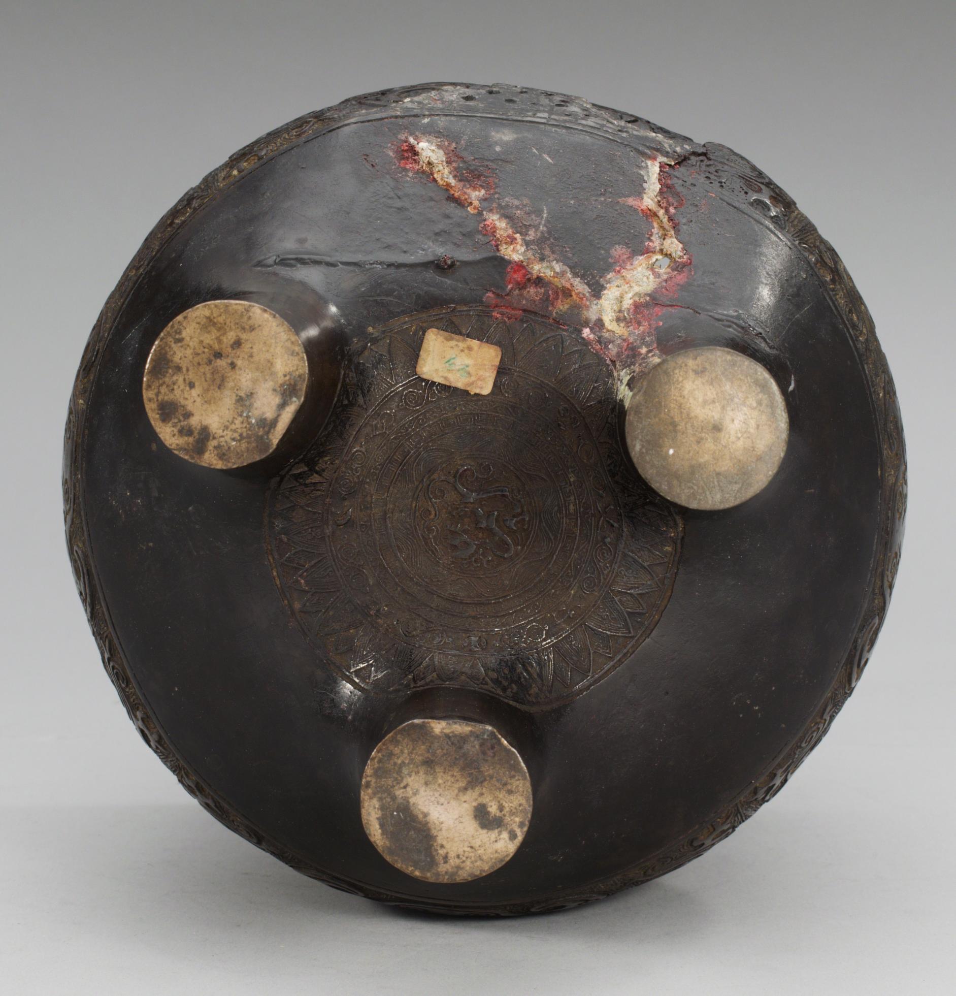 A large archaistic bronze tripod censer, probably Ming dynasty (1368-1644).