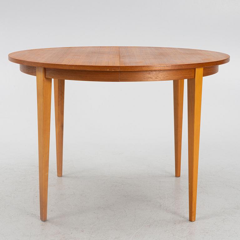 A teak-veneered dining table, mid 20th century.