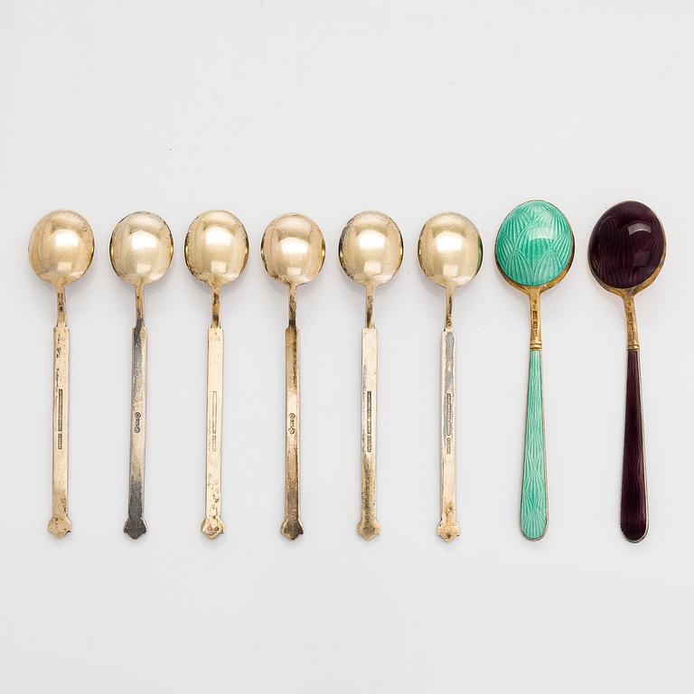 Eight gilt silver and enamel mocha spoons of which 6 by David Andersen, Norway, and 2 by Tillander, Finland.