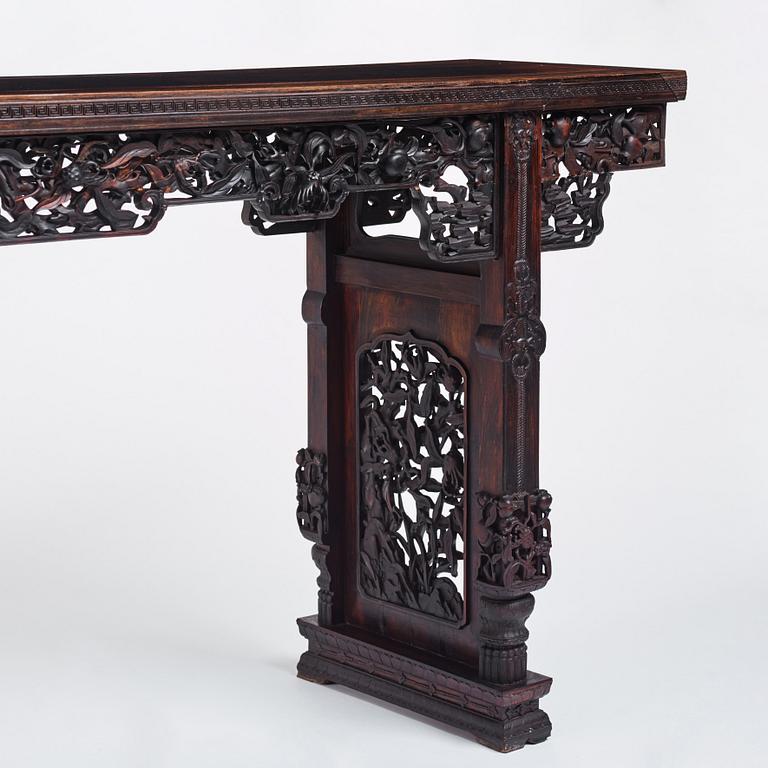 A massive zitan recessed-leg long table 'Jiaotousun Qiotouan', Qing dynasty, 19th century.