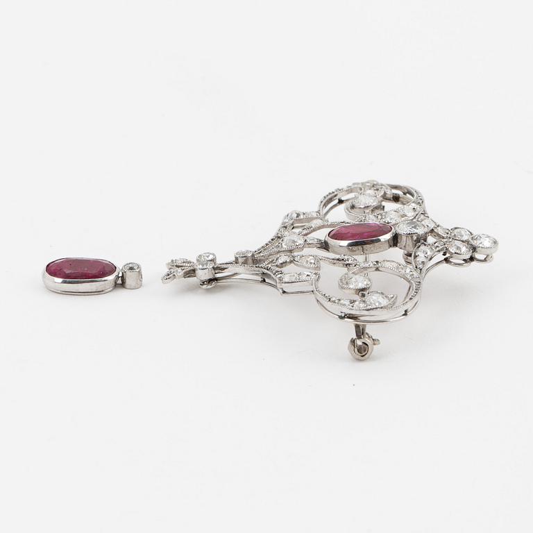 An old-cut diamond and ruby brooch.