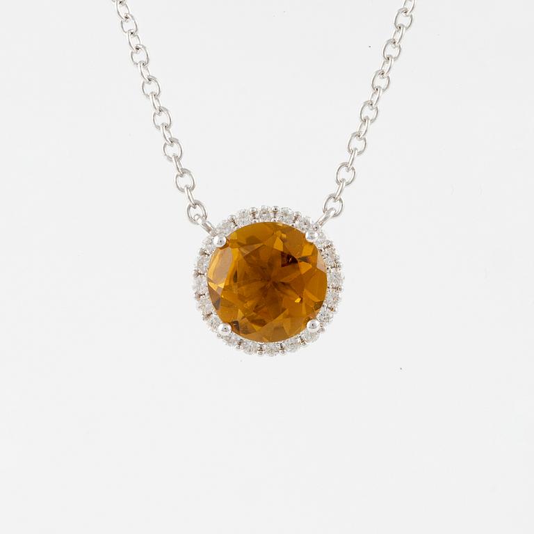 Necklace in 18K gold with a faceted tourmaline and round brilliant-cut diamonds.