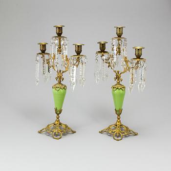 A pair of late 19th Century gilt candelabra.