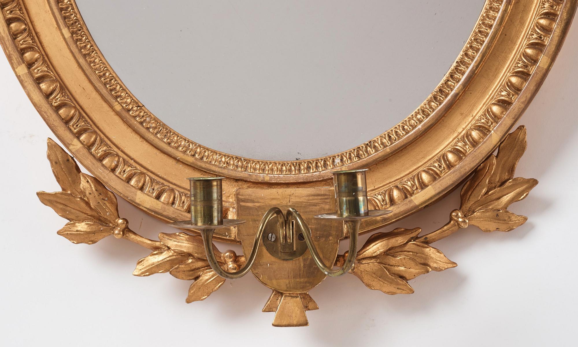 A Gustavian two light girandole mirror. (later copy will follow the lot).